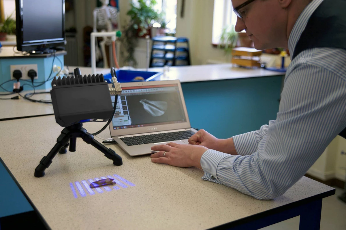 Tom using the HDI Compact 3D scanner in a teaching lab